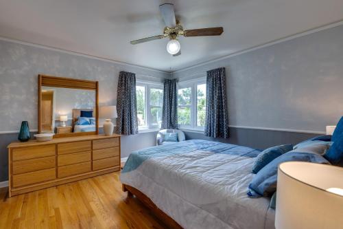 a bedroom with a bed and a mirror at Walk to Frontier Days Park Cheyenne Home with Patio in Cheyenne