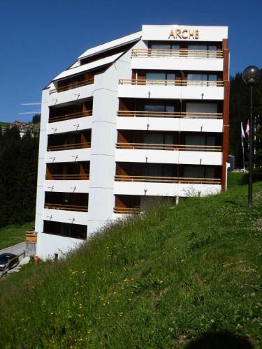 a white apartment building with an aace sign on it at Résidence Arche - Studio confortable · Centre station · Terrasse MAE-5084 in Magland