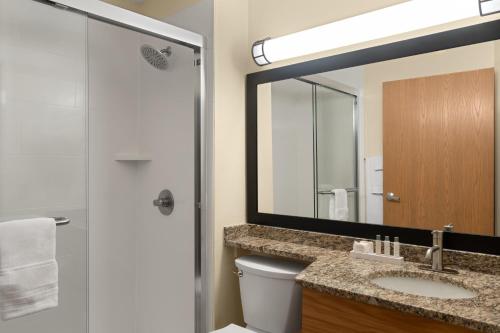 a bathroom with a sink and a mirror at Country Inn Two Harbors in Two Harbors