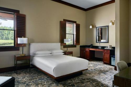 a bedroom with a bed and a sink in it at Montgomery Marriott Prattville Hotel & Conf Ctr at Capitol Hill in Prattville