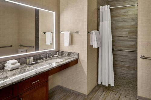 a bathroom with a sink and a shower at Montgomery Marriott Prattville Hotel & Conf Ctr at Capitol Hill in Prattville