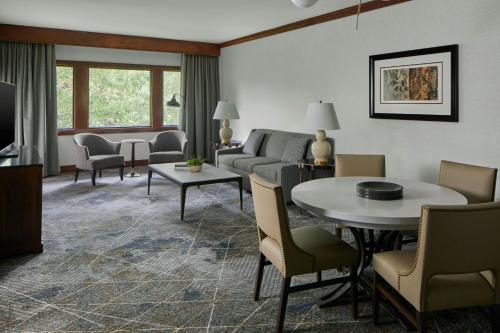 a living room with a couch and a table and chairs at Montgomery Marriott Prattville Hotel & Conf Ctr at Capitol Hill in Prattville