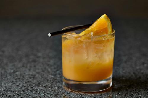 a drink with an orange slice on a table at Montgomery Marriott Prattville Hotel & Conf Ctr at Capitol Hill in Prattville