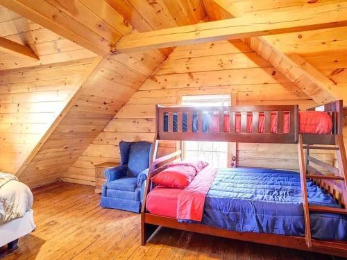 a bedroom with a bunk bed in a attic at Haven View Retreat in White Haven