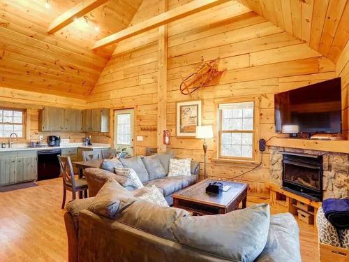 a living room with a couch and a fireplace at Haven View Retreat in White Haven