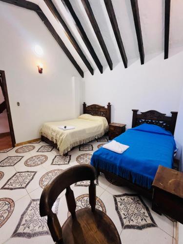 Cama o camas de una habitación en Posada Refugio Colonial