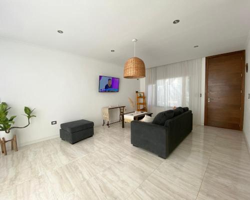 a living room with a couch and a table at Casa de Marianela in Chajarí