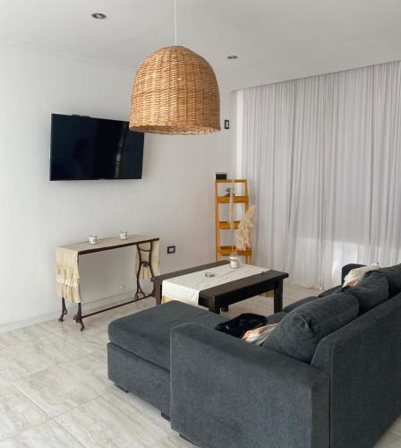 a living room with a couch and a table at Casa de Marianela in Chajarí