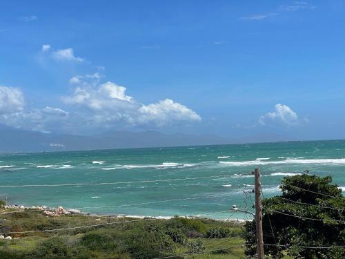 a view of the ocean on a sunny day at Ocean Paradise Getaway in Drunkenmans Cay