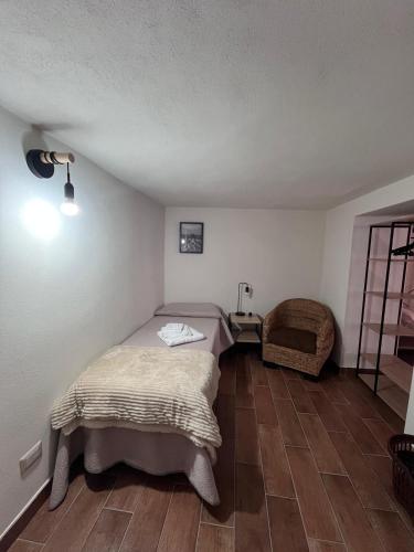 a bedroom with a bed and a table and a chair at Brèbrè in San Giovanni Gemini