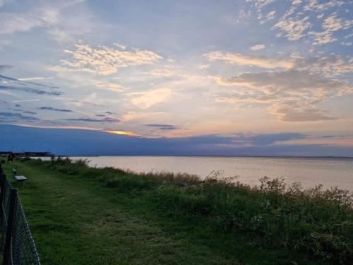 a view of a body of water with a cloudy sky at 5 person holiday park in Bogense in Bogense