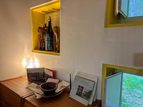 a wooden table with a bowl on top of it at Chalet Auralpina near Cortina Olympics Games 2026 in Borca di Cadore