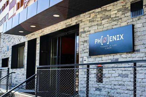 a building with a sign on the side of it at Résidence Phoenix - 5 pièces 8 personnes PREMIUM 4 MAE-0851 in Tignes