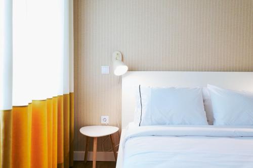 Postel nebo postele na pokoji v ubytování Espaço Quattro Apartamentos