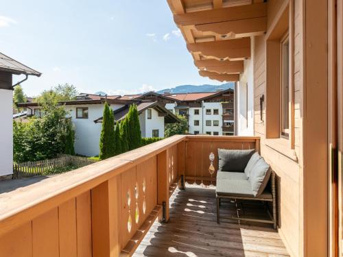 a balcony with a chair and a view at Appartement Dörler in Kirchberg in Tirol