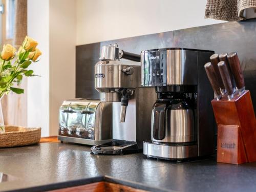 a coffee maker sitting on top of a counter at Kaiserblick Gasteig in Kirchdorf in Tirol
