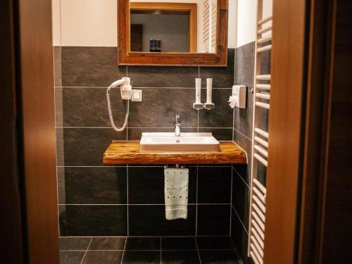 a bathroom with a sink and a mirror at Bösenstein in Hohentauern