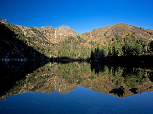 a reflection of a mountain in a lake at Bösenstein in Hohentauern