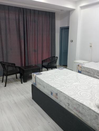 Katil atau katil-katil dalam bilik di Mr Khaled Hotel