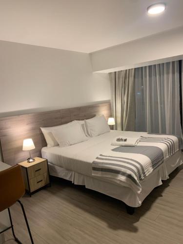Katil atau katil-katil dalam bilik di Urban Suites Apart Hotel