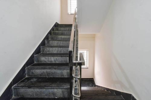 a staircase in a house with a window at Super Hotel O Gachibowli Near ISB in Hyderabad