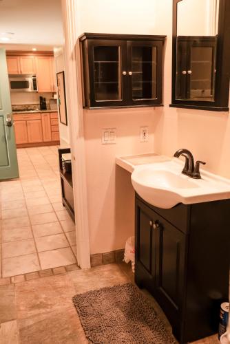 a kitchen with a sink and a counter top at Surfside Four in Port Hueneme