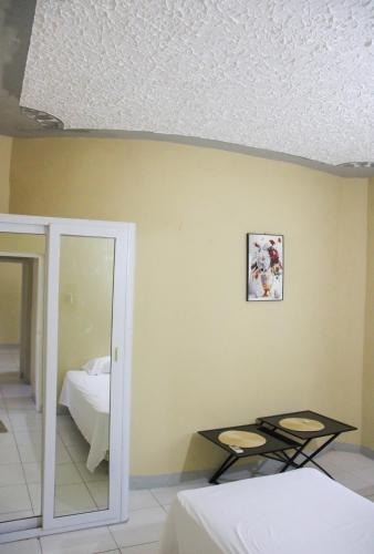 Ένα ή περισσότερα κρεβάτια σε δωμάτιο στο Oceanview 2BR Getaway 3min Beach 5min Airport