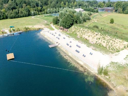an aerial view of a beach with people in the water at Idyllic Couple s Cottage in Antoing