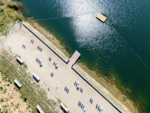 an aerial view of a beach with a group of boats at Idyllic Couple s Cottage in Antoing