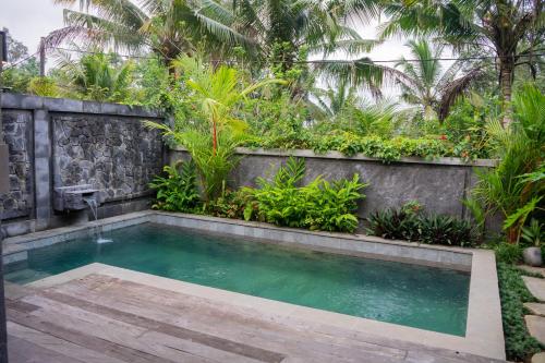 Piscina en o cerca de Ubud Paras Ayu Villa