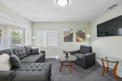 a living room with a couch and a table at Cozy Home 7 minutes Walk to UC Davis Sacramento in Sacramento