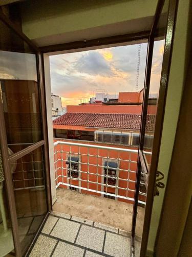 a view of a brick building from a window at Hotel Plaza in Tepatitlán de Morelos
