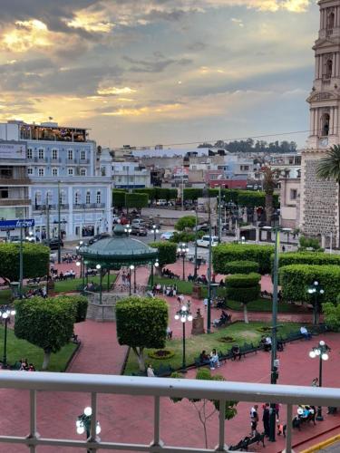 a view of a city with a park and buildings at Hotel Plaza in Tepatitlán de Morelos