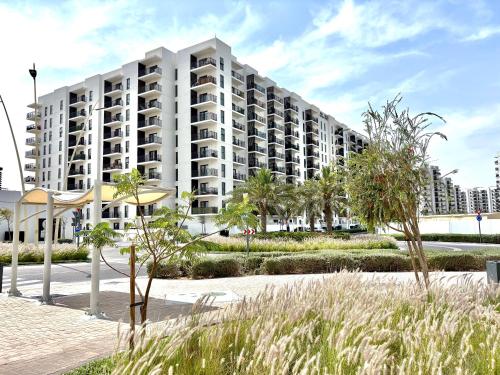 a rendering of a large apartment building at DVH Luxe Retreats 1BR Yas Island by Ferrari World and Yas Mall in Yas Island
