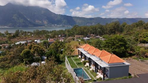 an aerial view of a house with an orange roof at The Infinity Kintamani With Natural Hot Spring in Kubupenlokan