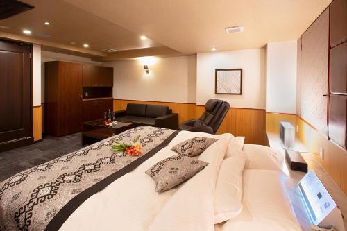 TV a/nebo společenská místnost v ubytování HOTEL MYTH Rinata -ホテル マイス リナータ- Adult Only