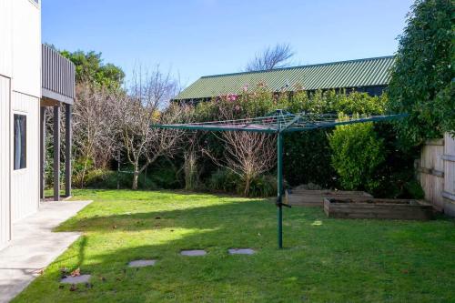 a blue basketball hoop in the middle of a yard at Mercy of Lake Taupo in Taupo