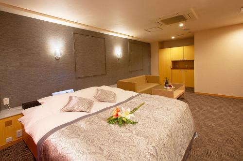 Postel nebo postele na pokoji v ubytování HOTEL MYTH Rinata -ホテル マイス リナータ- Adult Only