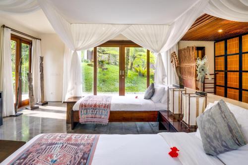 Postel nebo postele na pokoji v ubytování Awan Putih Resort