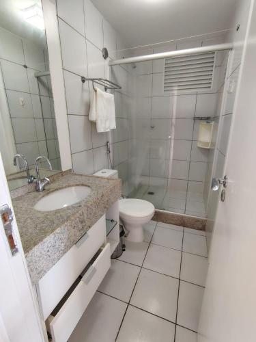 a bathroom with a sink and a toilet and a shower at Resort Grand solare residence in Barreirinhas