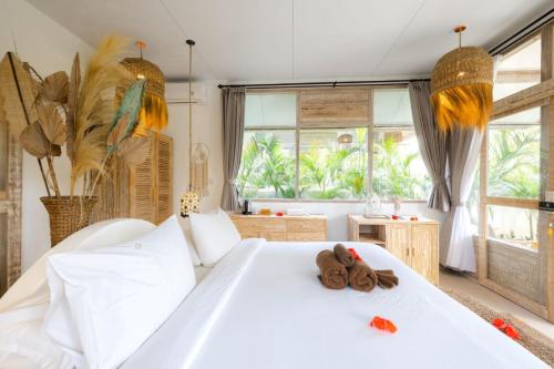 Postel nebo postele na pokoji v ubytování La Joya Balangan Resort