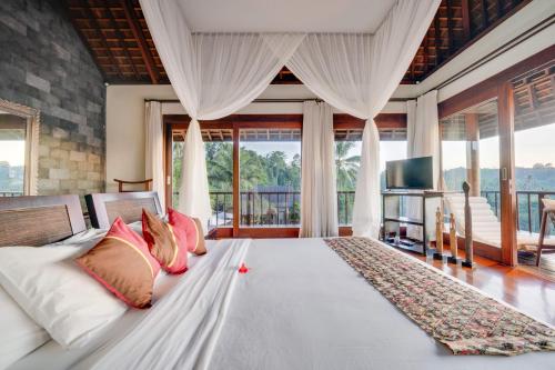 Postel nebo postele na pokoji v ubytování Awan Putih Resort