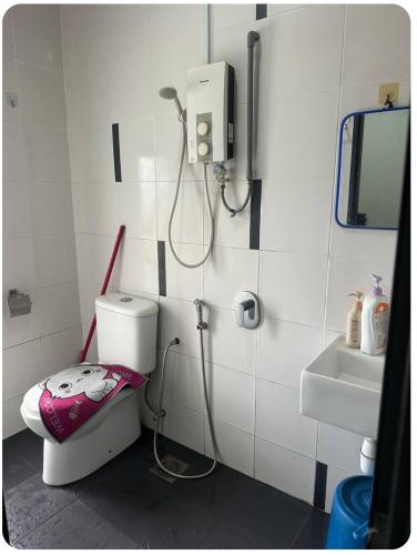 a bathroom with a shower and a toilet and a sink at Suria jaya studio condo shah alam in Shah Alam