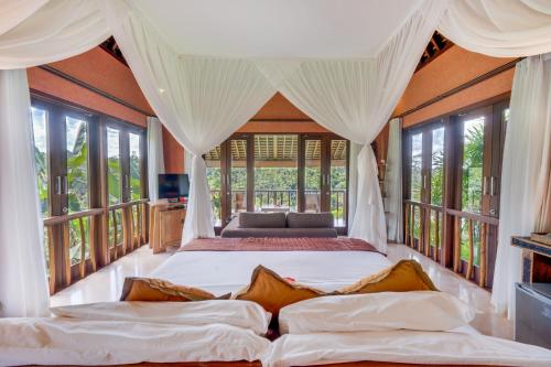 Postel nebo postele na pokoji v ubytování Awan Putih Resort