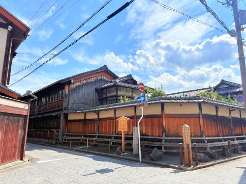 a building with a sign in front of it at 夏様五条丹波口 Modern Kyoto Townhouse, Whole House in Kyoto