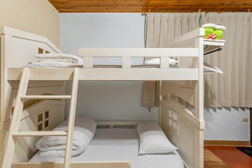 a bunk bed room with two bunk beds at Hill Side B&B in Yuchi