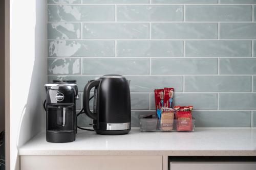 a coffeemaker sitting on top of a counter at Ocean Views on Grundy I New Home I Family Friendly in Christies Beach