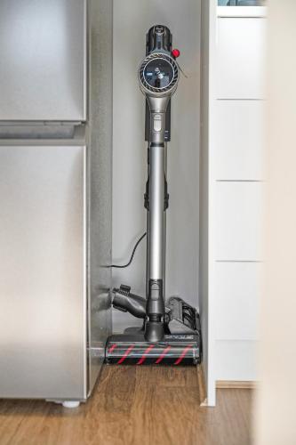 a vacuum in the corner of a kitchen door at Ocean Views on Grundy I New Home I Family Friendly in Christies Beach