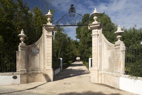 an entrance to a fence with an archway at Hotel Quinta das Lagrimas - Small Luxury Hotels in Coimbra