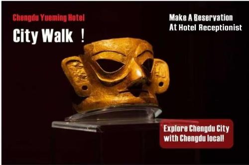 a gold mask on display in a display case at Chengdu Yueming Hotel,2-minute walk to Zhongba Subway ,close to Kuanzhai Alley and Chunxi Road,Free laundry, Free coffee, Chengdu food,English communication well,Private travel advice in Chengdu